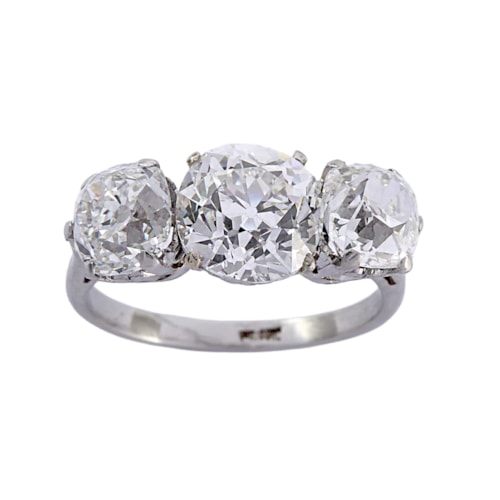 Three stone graduated old cushion cut diamond ring, the old mine cut diamonds of 2.02ct G SI, 1.09ct F SI1 and 1.02ct G VS2,
